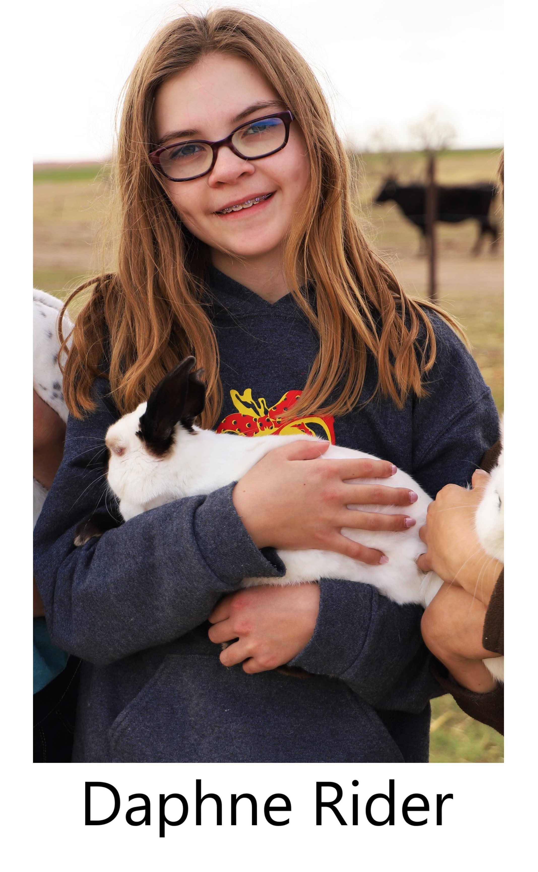 Daphne Rider holding a rabbit.