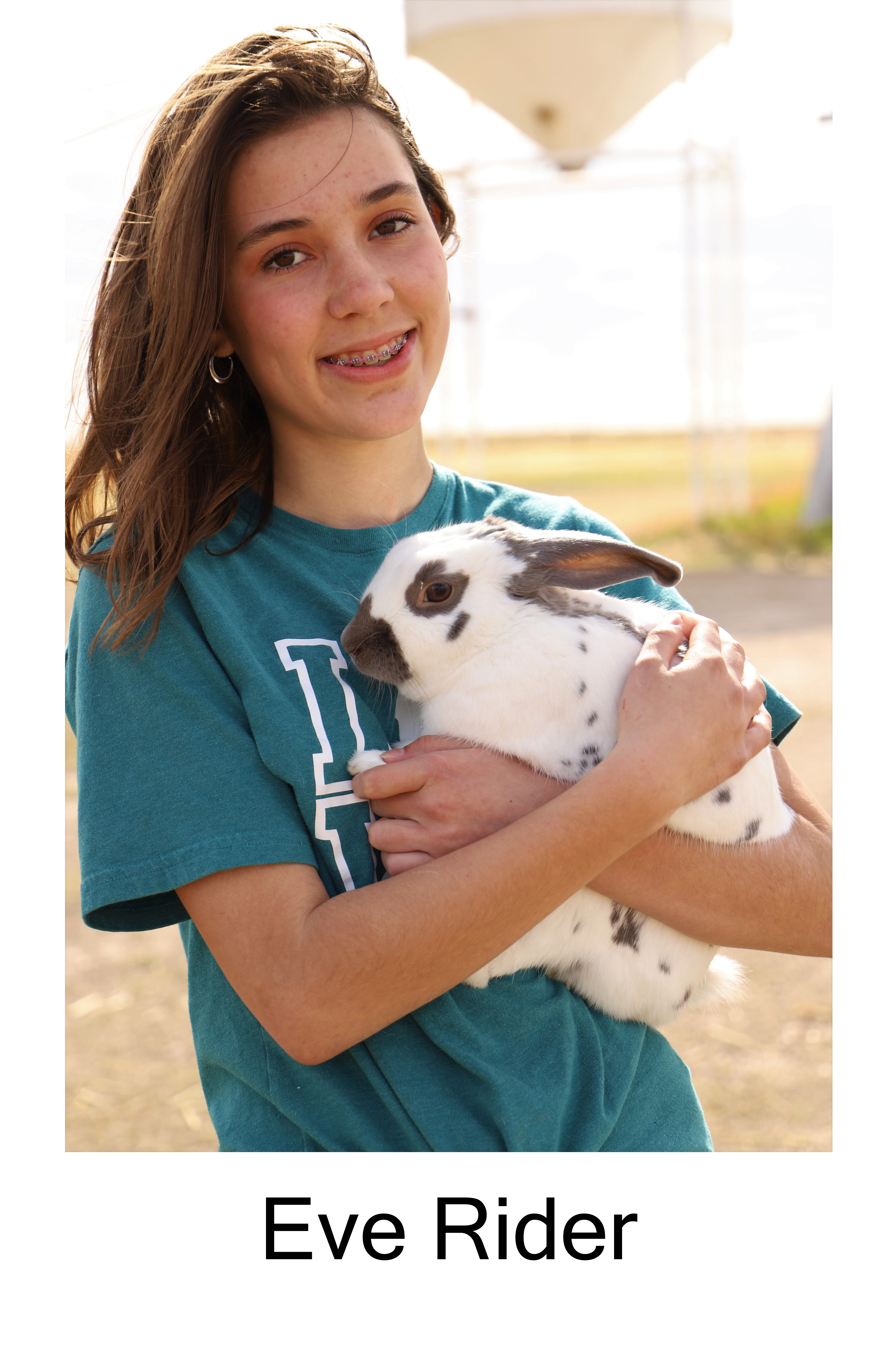 Eve Rider holding a rabbit.